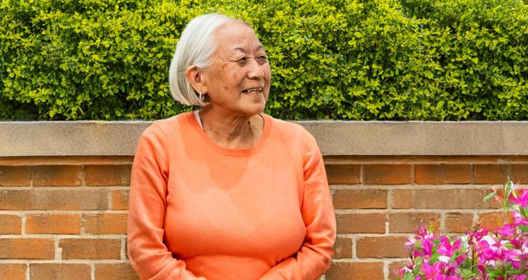 Elderly Woman In Garden