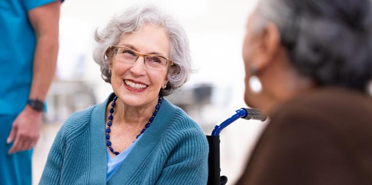 Elder Woman Smiling to Another Woman