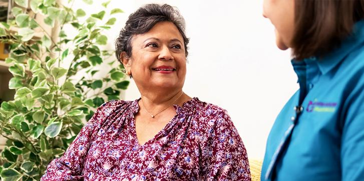 A Elderly Woman Talking with Another Woman