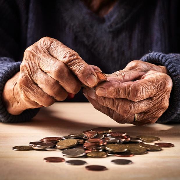Elderly Hands Counting Coins