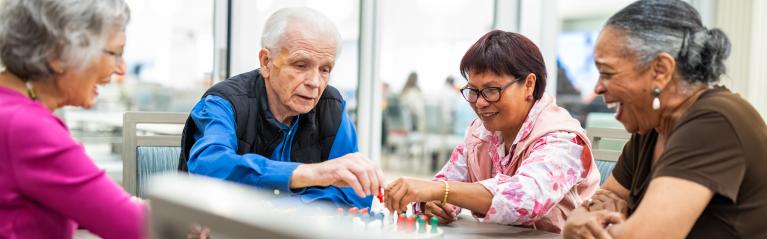 Group of Elder Seniors Playing Board Game
