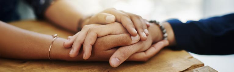 Caregiver Holding Elderly Patient Hand