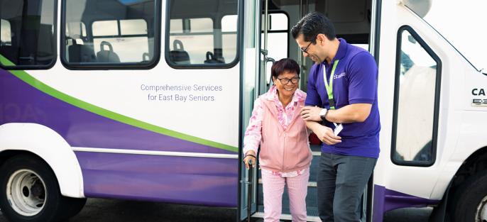 Caregiver Helping Patient Get Down of the Bus