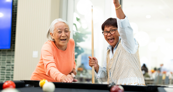 Elderly Women Playing Billard