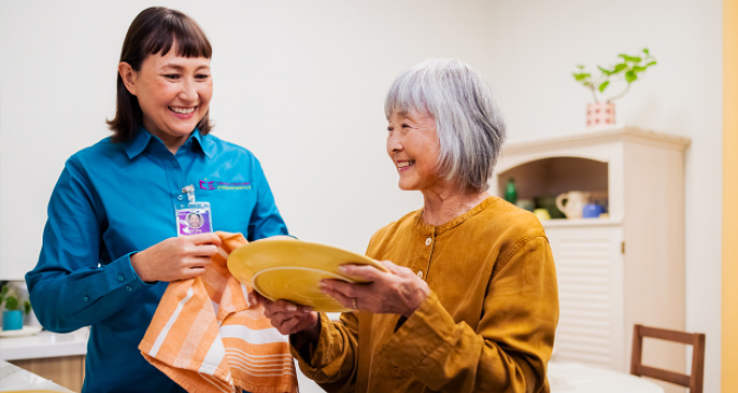Caregiver Helping a Elderly Woman on House Activities